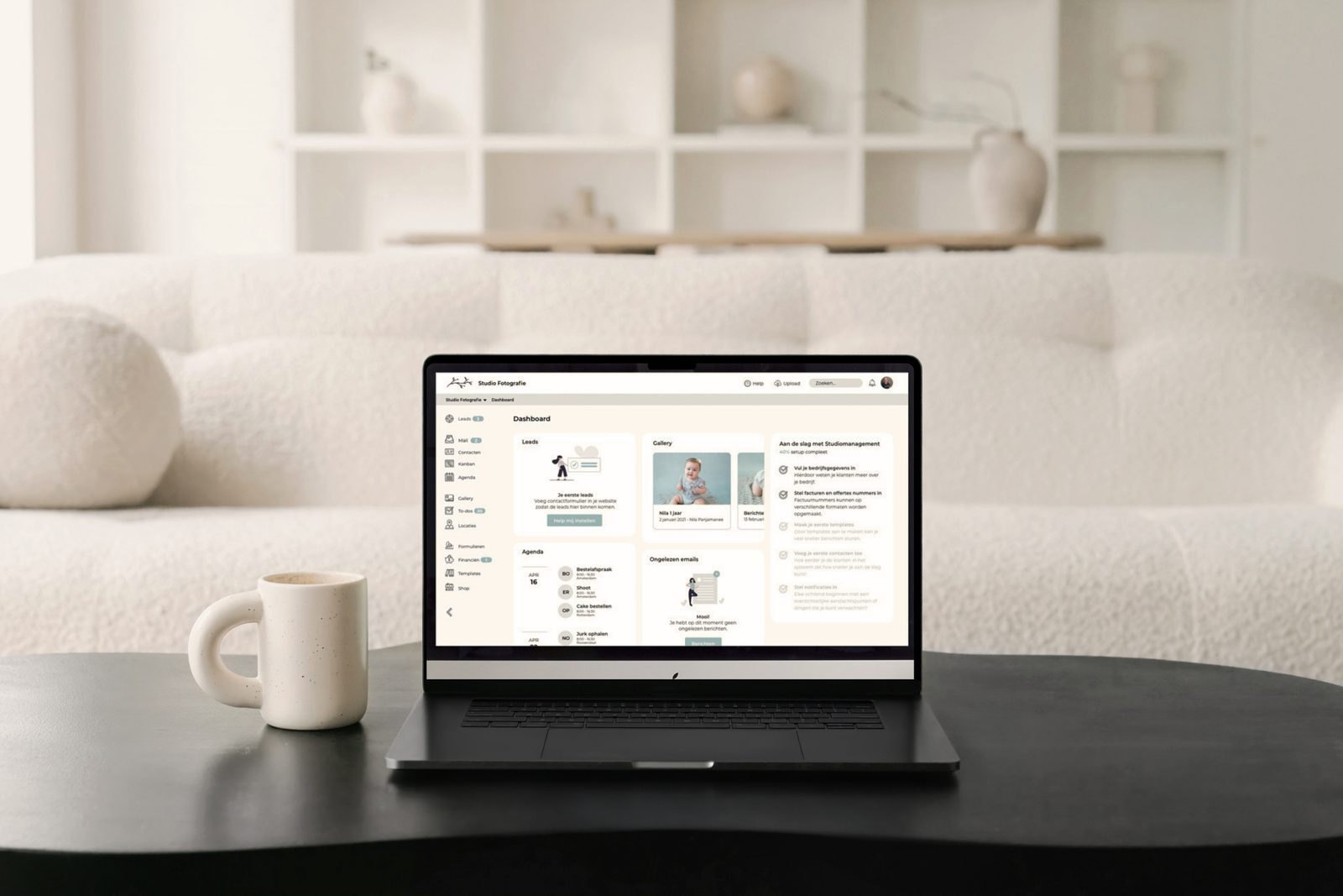 Studio Management dashboard open on a laptop